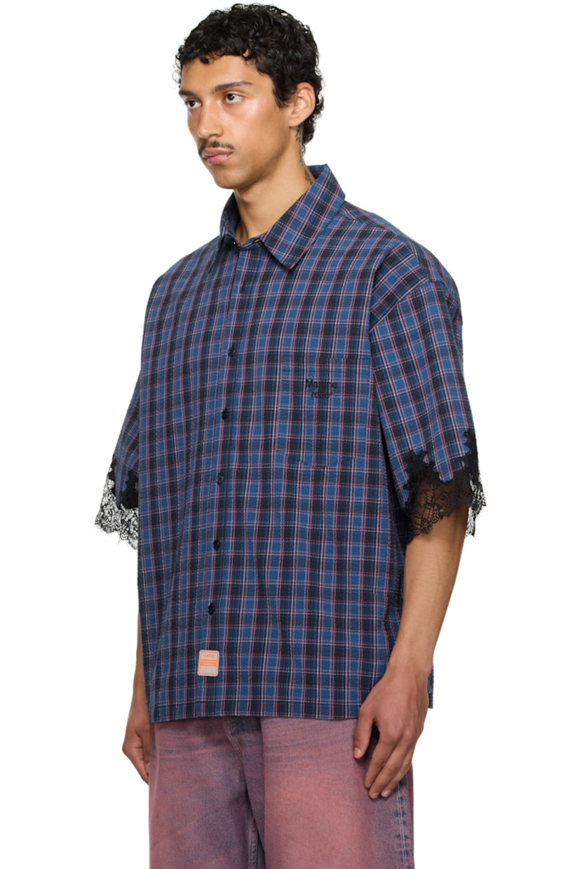 Cotton seersucker overshirt. Check pattern throughout.

· Spread collar
· Button closure
· Logo-embroidered patch pocket
· Reflective logo patch at front
· Dropped shoulders
· Scalloped lace trim at cuffs
· Box pleat at back yoke

Part of the exclusive SSENSE HEAT capsule.

Supplier color: Blue navy check