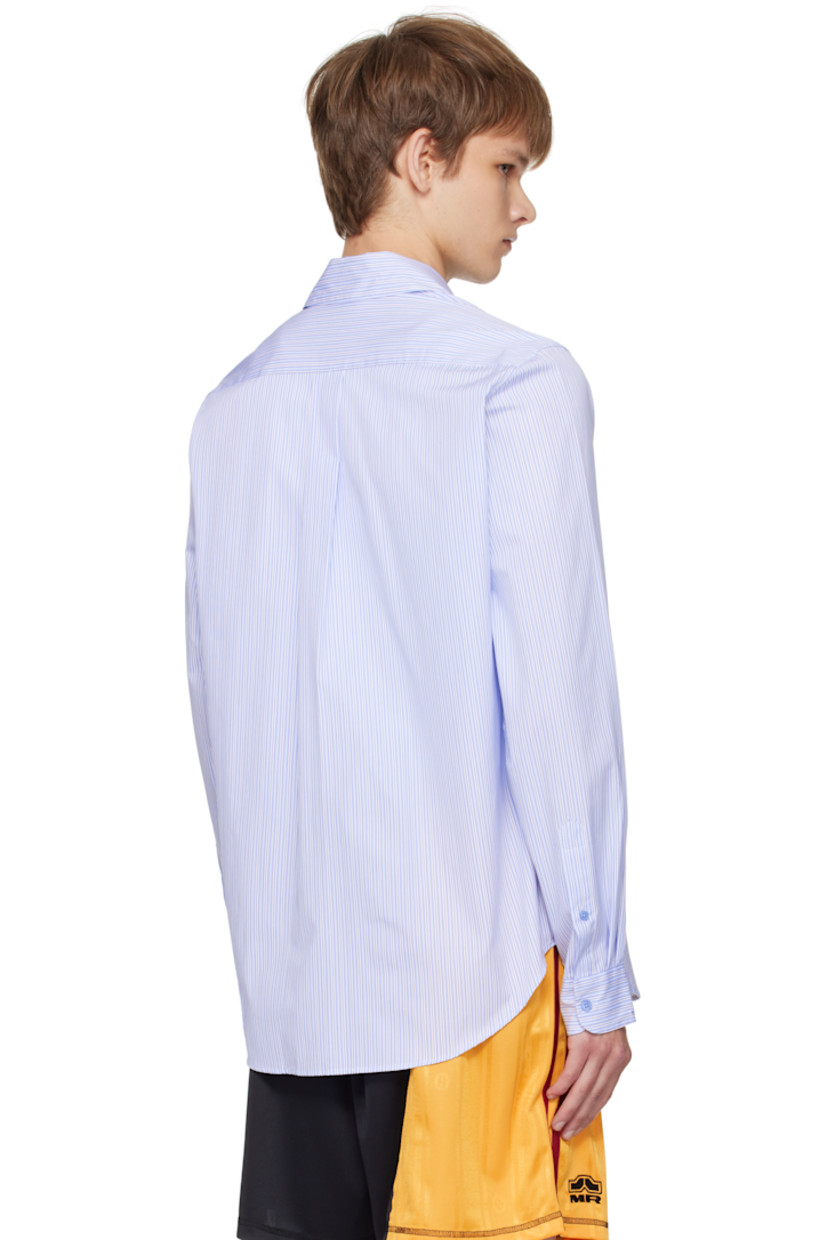 Cotton poplin shirt.

· Stripes throughout
· Spread collar
· Button closure
· Logo patch at front
· Shirttail hem
· Buttoned barrel cuffs
· Box pleat at back yoke

Supplier color: Blue stripe