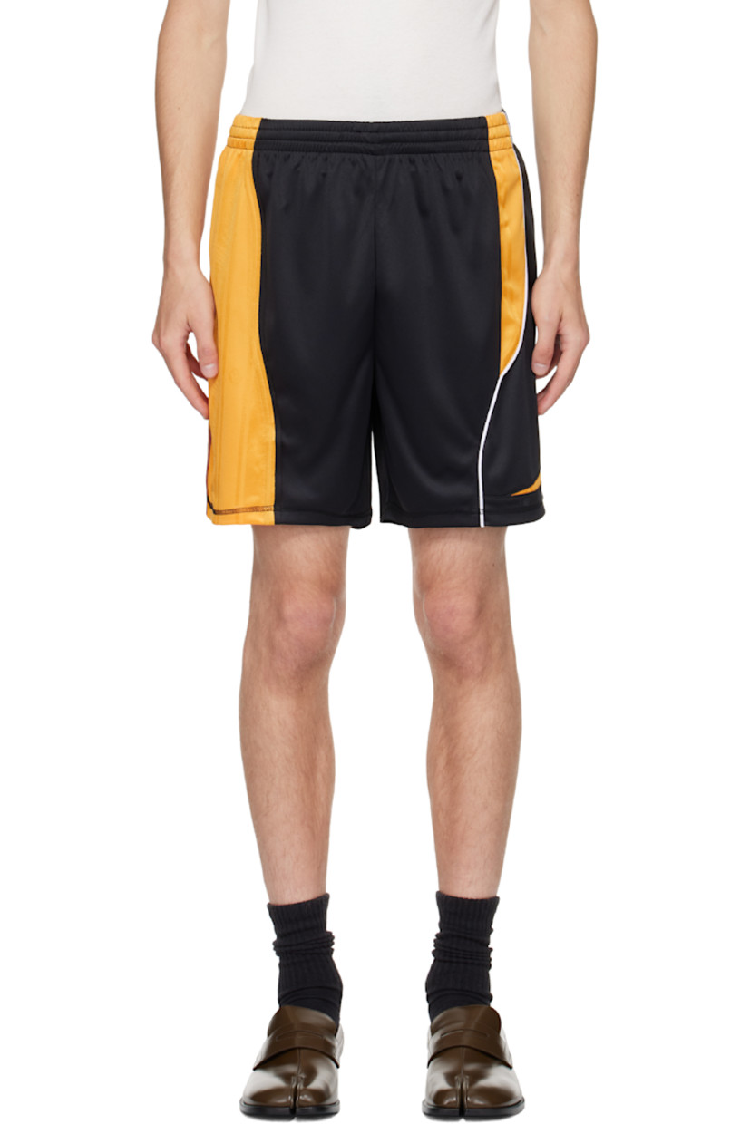 Mesh shorts.

· Concealed drawstring at elasticized waistband
· Logo embroidered at front cuff
· Piping at outseam
· Stripe appliqués at outseam

Supplier color: Black/Gold