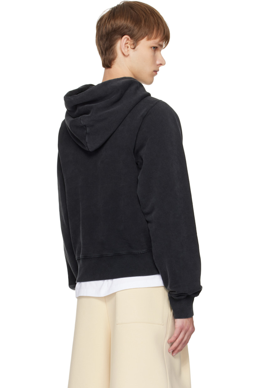 Cotton fleece hoodie.

· Fading throughout
· Drawstring at hood
· Logo bonded at front
· Kangaroo pocket
· Rib-knit hem and cuffs

Supplier color: Black Washed