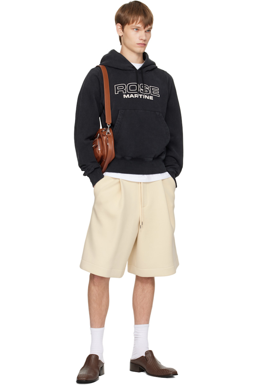 Cotton fleece hoodie.

· Fading throughout
· Drawstring at hood
· Logo bonded at front
· Kangaroo pocket
· Rib-knit hem and cuffs

Supplier color: Black Washed
