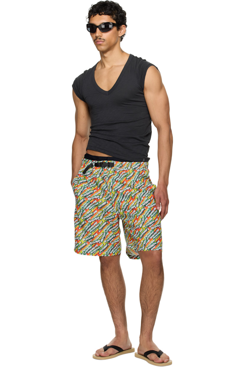 Polyester taffeta swim shorts. Logo graphic pattern printed throughout.

· Integrated press-release belt at elasticized waistband
· Three-pocket styling
· Unlined

Part of the exclusive SSENSE HEAT capsule. 

Supplier color: Green/Orange