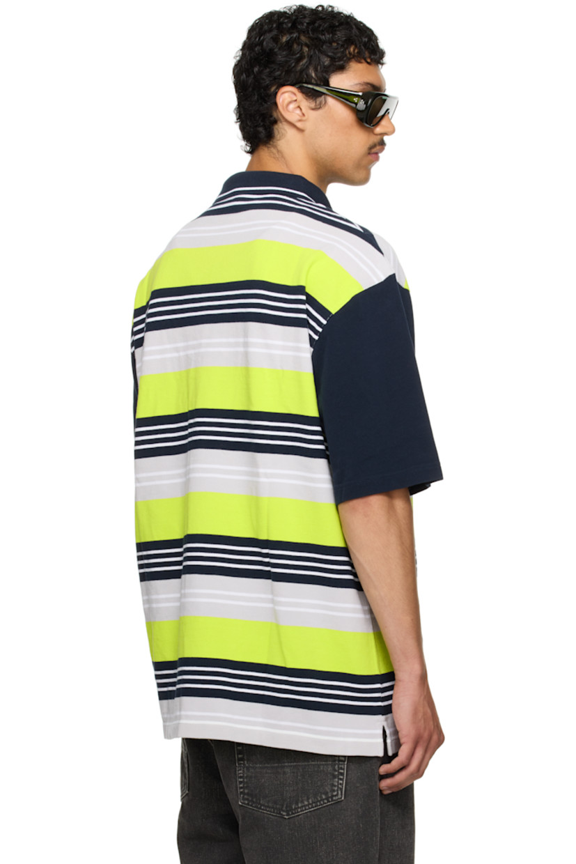 Oversized cotton piqué polo. Stripes throughout.

· Rib-knit spread collar
· Two-button placket
· Logo embroidered at chest and hem
· Logo printed at front
· Tennis-tail hem
· Dropped shoulders

Part of the exclusive SSENSE HEAT capsule.

Supplier color: Blue/Navy/Lime