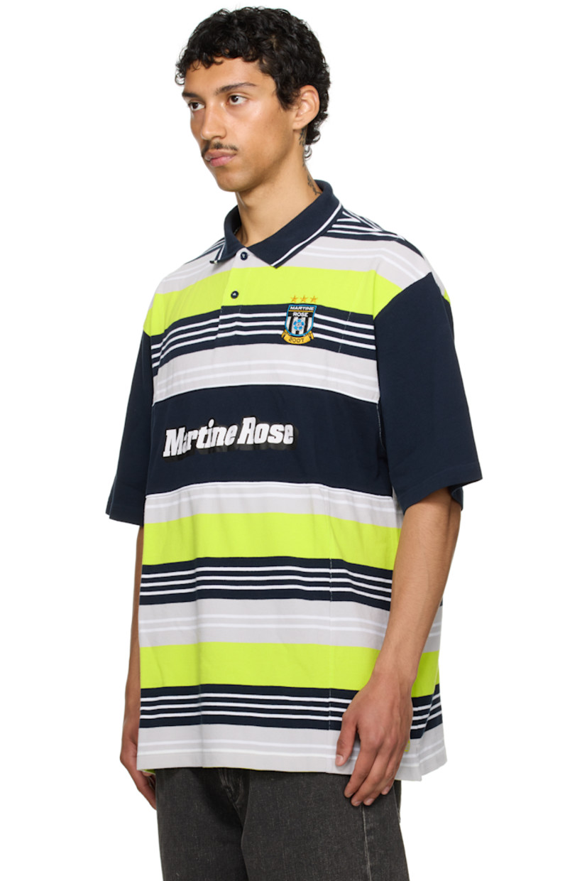 Oversized cotton piqué polo. Stripes throughout.

· Rib-knit spread collar
· Two-button placket
· Logo embroidered at chest and hem
· Logo printed at front
· Tennis-tail hem
· Dropped shoulders

Part of the exclusive SSENSE HEAT capsule.

Supplier color: Blue/Navy/Lime