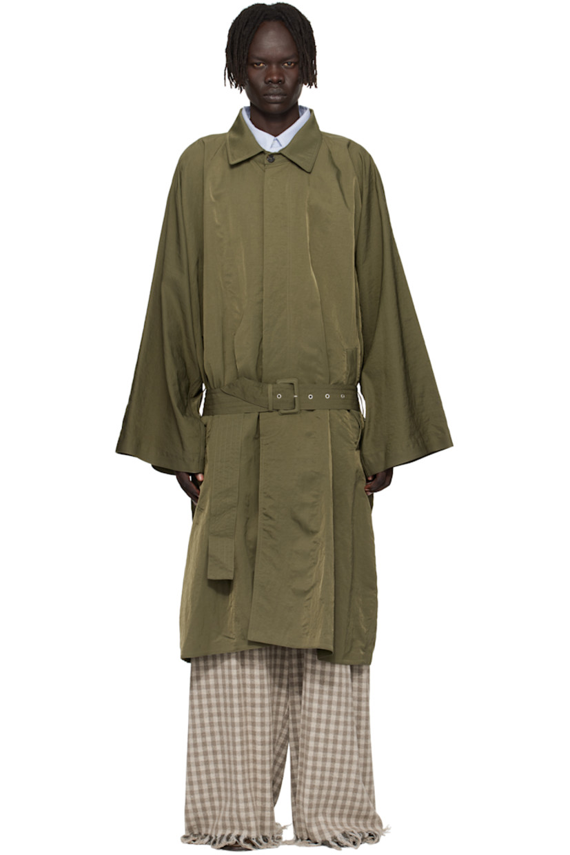 Crinkled nylon taffeta trench coat. 

· Spread collar 
· Button closure
· Belt loops and welt pockets at waist 
· Detachable pin-buckle belt 
· Grommets at sides 
· Central vent at back hem
· Welt pocket at interior 

Supplier color: Green