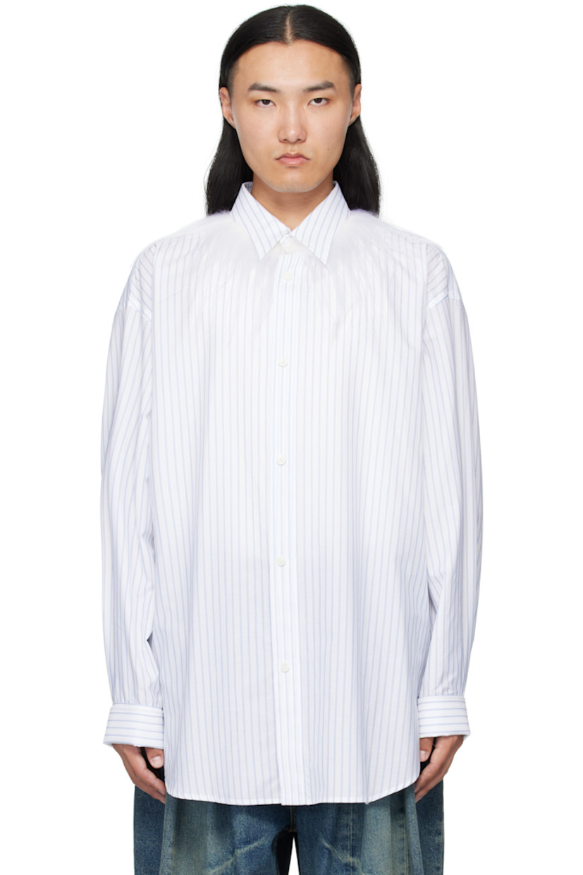 Cotton poplin shirt.

· Pinstripes and raised check stripes throughout
· Spread collar with goatskin fleece trim
· Button closure
· Shirttail hem
· Dropped shoulders
· French cuffs
· Box pleat at back yoke

Supplier color: Natural