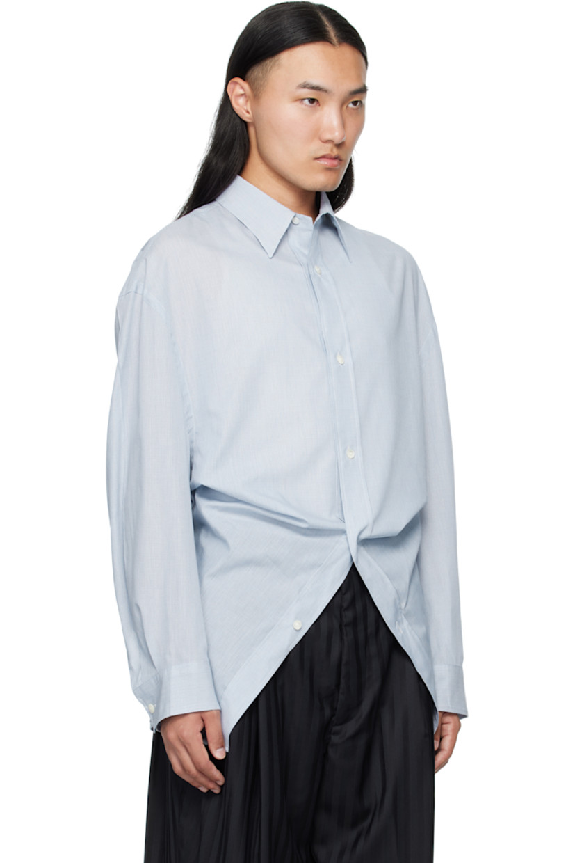 Lightweight cotton poplin shirt.

· Semi-sheer
· Button closure
· Modified hem
· Dropped shoulders and armscyes
· Buttoned barrel cuffs

Supplier color: Light/Pastel blue