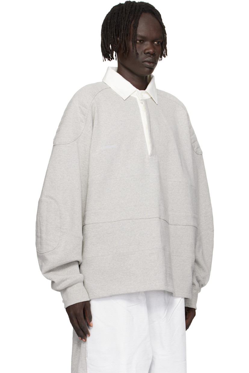 Recycled cotton-blend French terry polo. 

· Paneled construction
· Cotton twill spread collar  
· Concealed four-button placket  
· Vented side seams 
· Quilted panel at modified saddle shoulders
· Quilted elbow patches
· Rib-knit cuffs

Supplier color: Medium grey