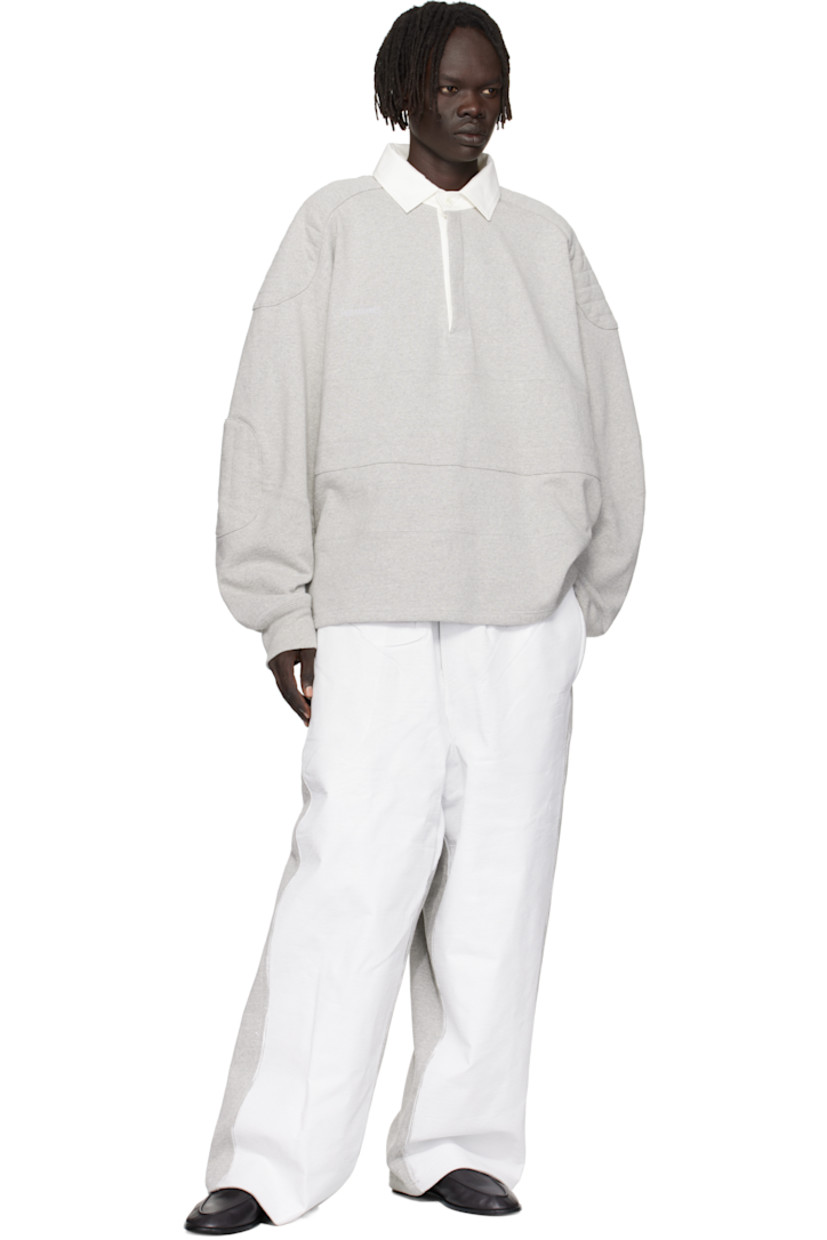 Recycled cotton-blend French terry polo. 

· Paneled construction
· Cotton twill spread collar  
· Concealed four-button placket  
· Vented side seams 
· Quilted panel at modified saddle shoulders
· Quilted elbow patches
· Rib-knit cuffs

Supplier color: Medium grey