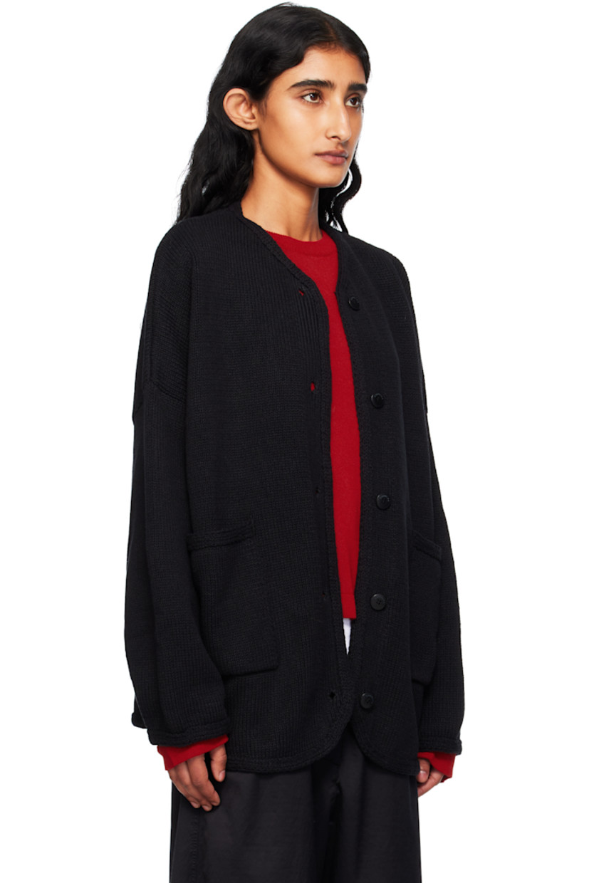 Knit ECOTEC® recycled cotton-blend cardigan. 

· Oversized
· Crewneck
· Button closure
· Patch pockets at front 
· Shirttail hem
· Dropped shoulders
· Logo-engraved hardware

Supplier color: Black