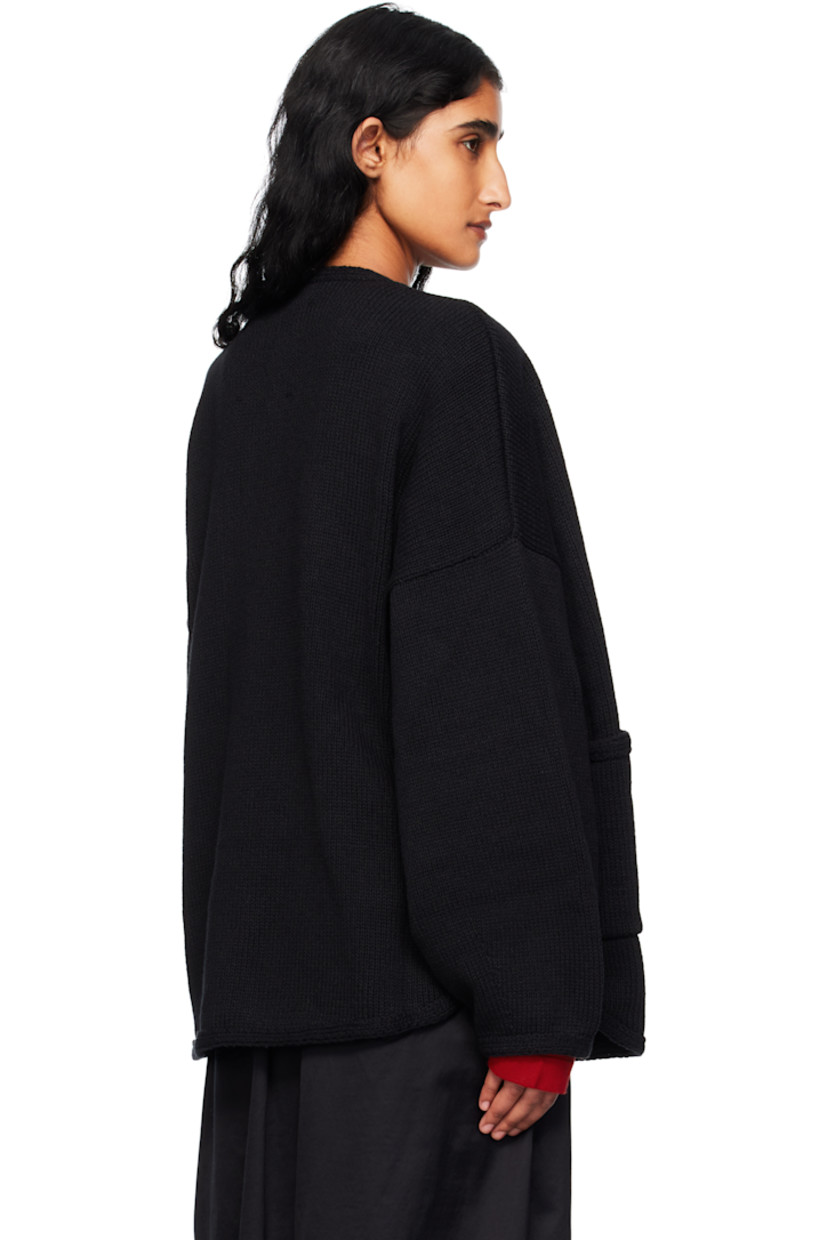 Knit ECOTEC® recycled cotton-blend cardigan. 

· Oversized
· Crewneck
· Button closure
· Patch pockets at front 
· Shirttail hem
· Dropped shoulders
· Logo-engraved hardware

Supplier color: Black