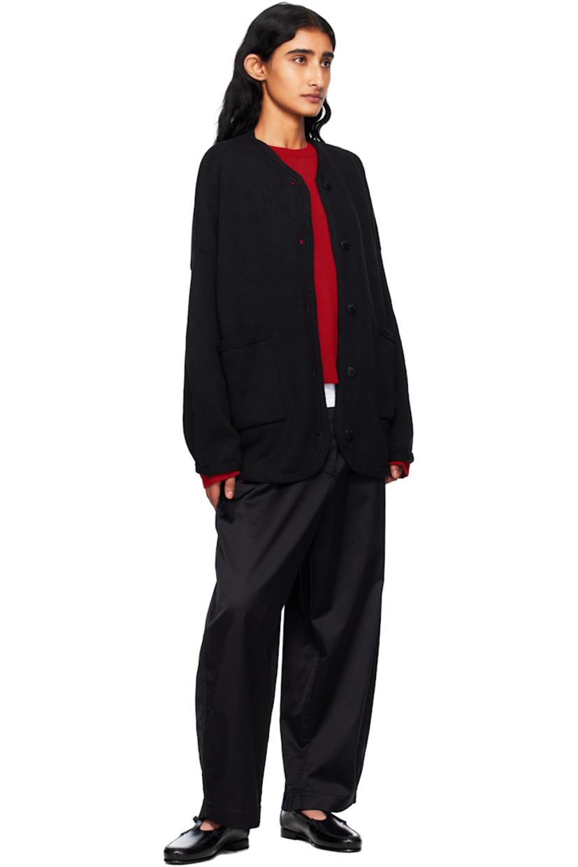 Knit ECOTEC® recycled cotton-blend cardigan. 

· Oversized
· Crewneck
· Button closure
· Patch pockets at front 
· Shirttail hem
· Dropped shoulders
· Logo-engraved hardware

Supplier color: Black