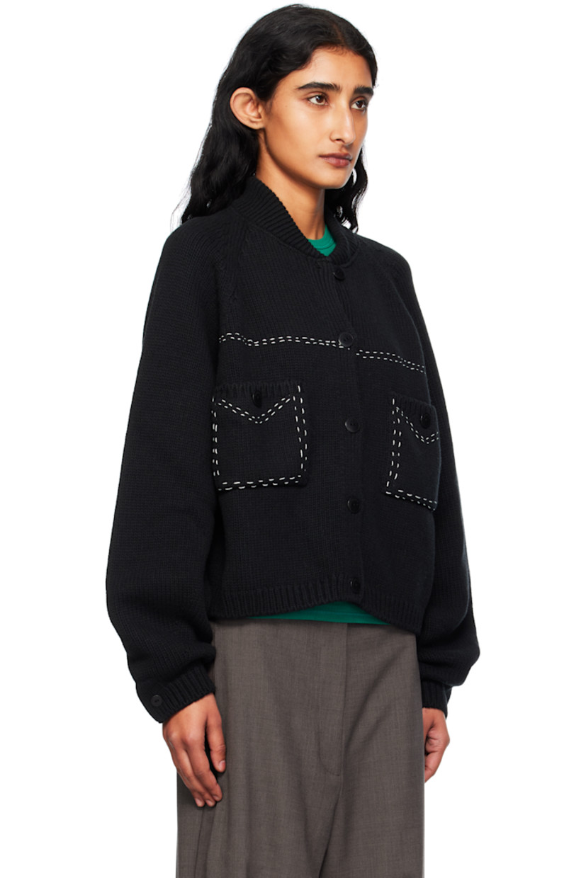 Knit merino wool cardigan.

· Rib-knit stand collar, hem, and cuffs
· Button closure
· Patch pockets at chest
· Topstitching in white at front
· Cropped hem
· Raglan sleeves

Supplier color: Black