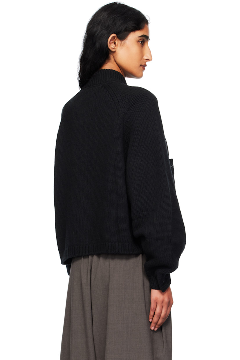 Knit merino wool cardigan.

· Rib-knit stand collar, hem, and cuffs
· Button closure
· Patch pockets at chest
· Topstitching in white at front
· Cropped hem
· Raglan sleeves

Supplier color: Black