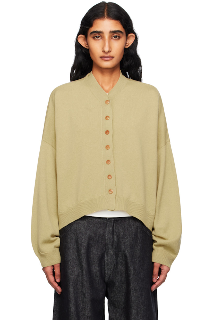Knit extrafine merino wool cardigan.

· Oversized
· Rib-knit Y-neck, hem, and cuffs
· Button closure
· Cropped curved hem
· Dropped shoulders
· Notch at back collar
· Logo-engraved hardware

Supplier color: Butter