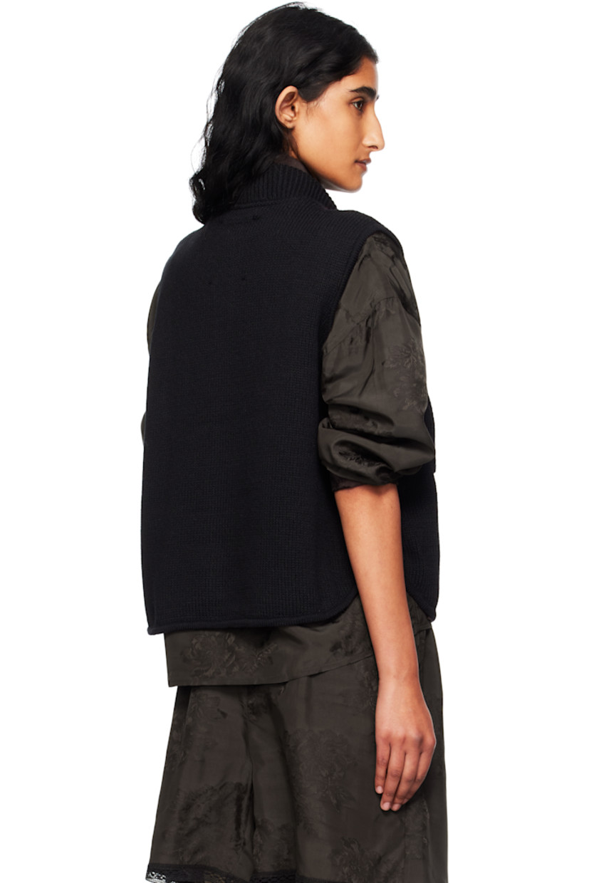 Knit ECOTEC® upcycled cotton-blend cardigan.

· Rib-knit stand collar
· Button closure
· Patch pockets at front
· Logo-engraved hardware

Supplier color: Black