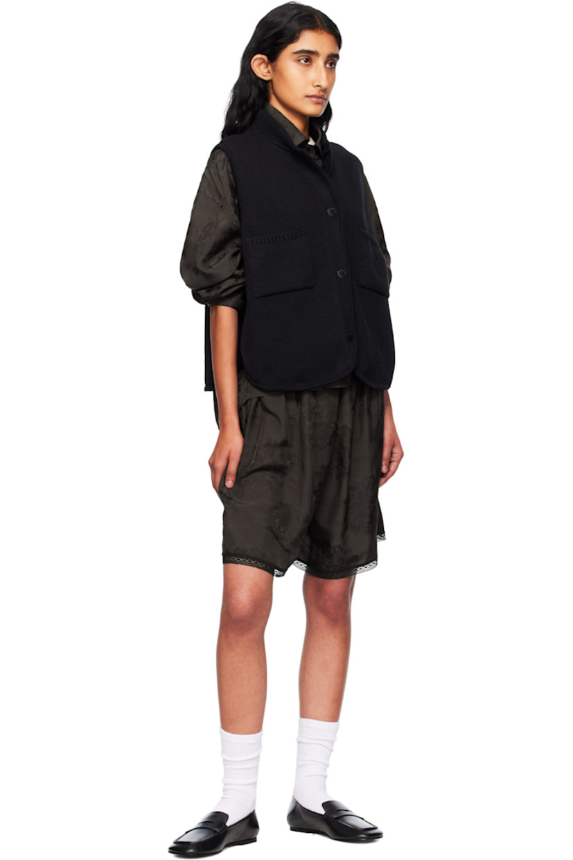 Knit ECOTEC® upcycled cotton-blend cardigan.

· Rib-knit stand collar
· Button closure
· Patch pockets at front
· Logo-engraved hardware

Supplier color: Black