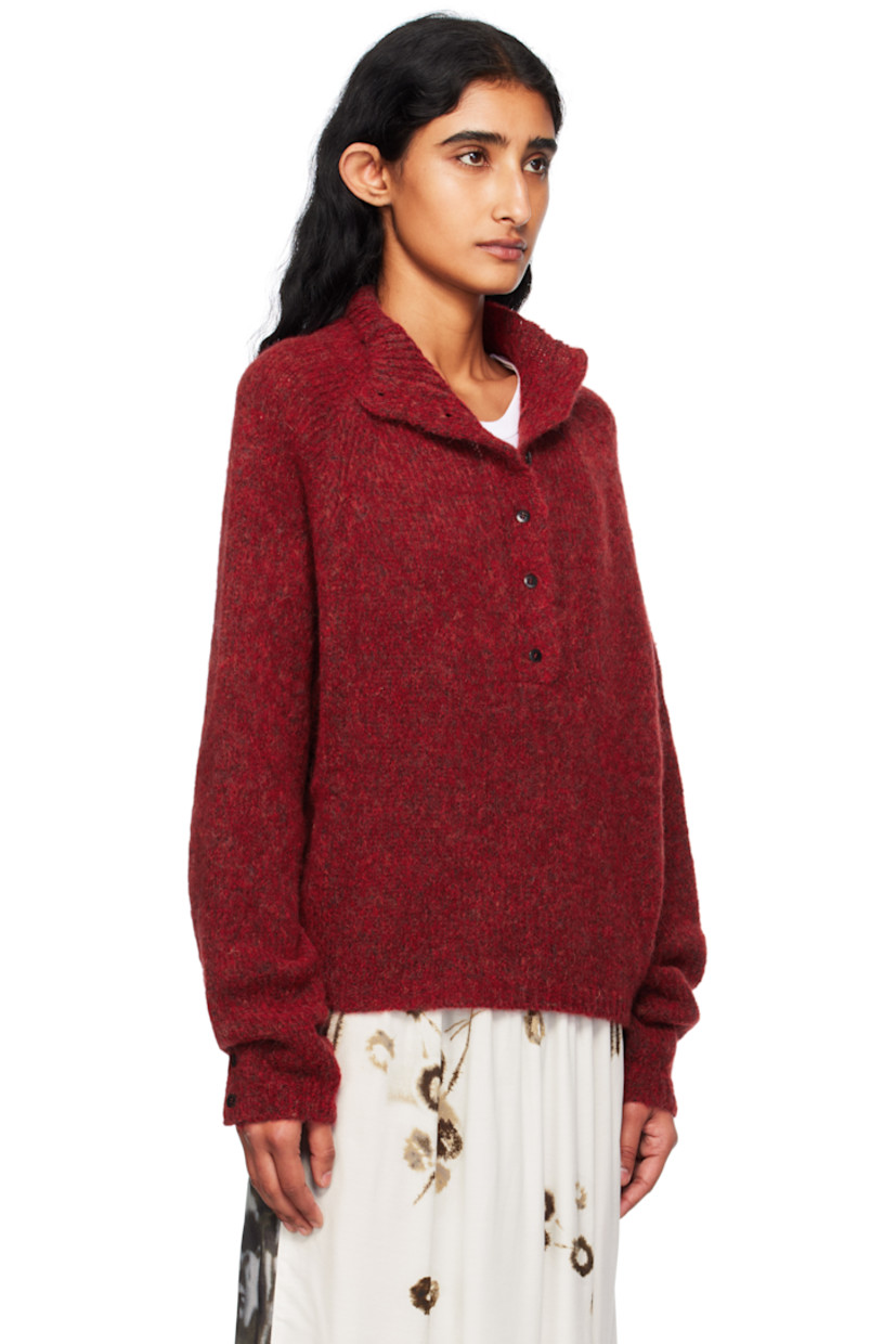 Brushed knit baby alpaca-blend sweater.

· Rib-knit mock neck, hem, and cuffs
· Six-button placket
· Raglan sleeves
· Button vent at cuffs
· Logo-engraved hardware

Supplier color: Dahlia