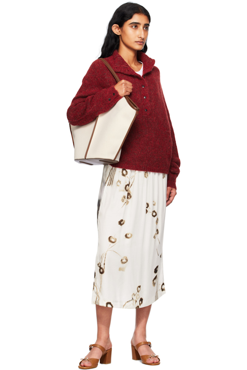 Brushed knit baby alpaca-blend sweater.

· Rib-knit mock neck, hem, and cuffs
· Six-button placket
· Raglan sleeves
· Button vent at cuffs
· Logo-engraved hardware

Supplier color: Dahlia