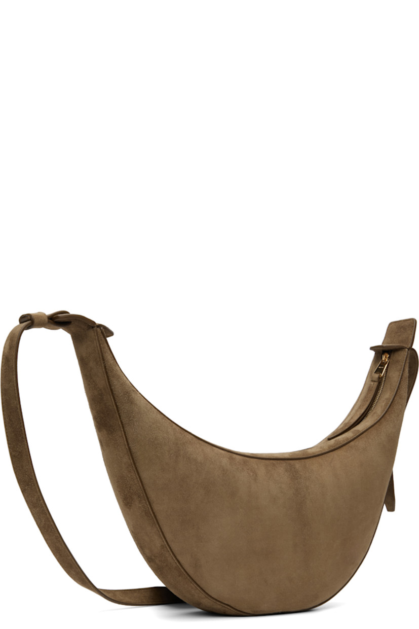 Calfskin suede shoulder bag.

· Adjustable crossbody strap
· Embossed logo at face
· Zip closure
· Grained calfskin interior
· Unlined
· H7" x W15" x D2.75"

Supplier color: Mud suede
