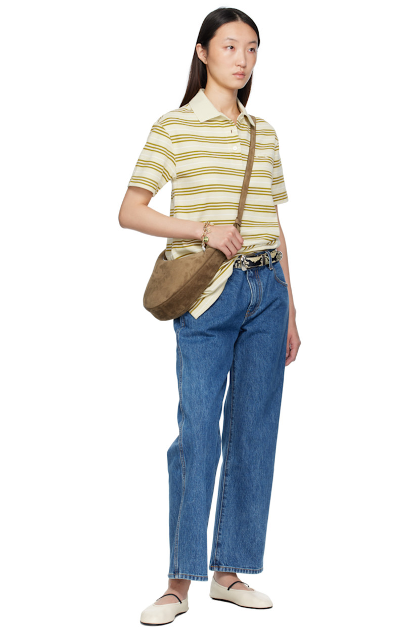 Calfskin suede shoulder bag.

· Adjustable crossbody strap
· Embossed logo at face
· Zip closure
· Grained calfskin interior
· Unlined
· H7" x W15" x D2.75"

Supplier color: Mud suede