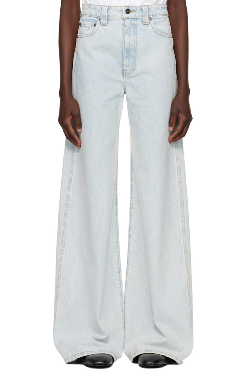 Flared wide-leg stretch denim jeans. Fading, whiskering, and subtle distressing throughout.

· High-rise
· Belt loops
· Five-pocket styling
· Button fly
· Logo-engraved gunmetal-tone hardware
· Contrast stitching in tan

Supplier color: Shelburne