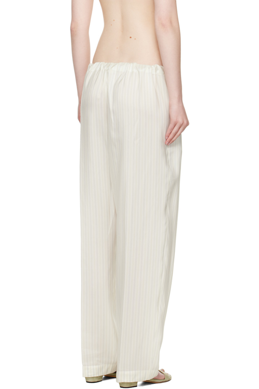 Loose-fit silk-blend poplin trousers. Stripes throughout.

· Drawstring at elasticized waistband 
· Two-pocket styling
· Pleats at front 

Supplier color: Multicolor stripe