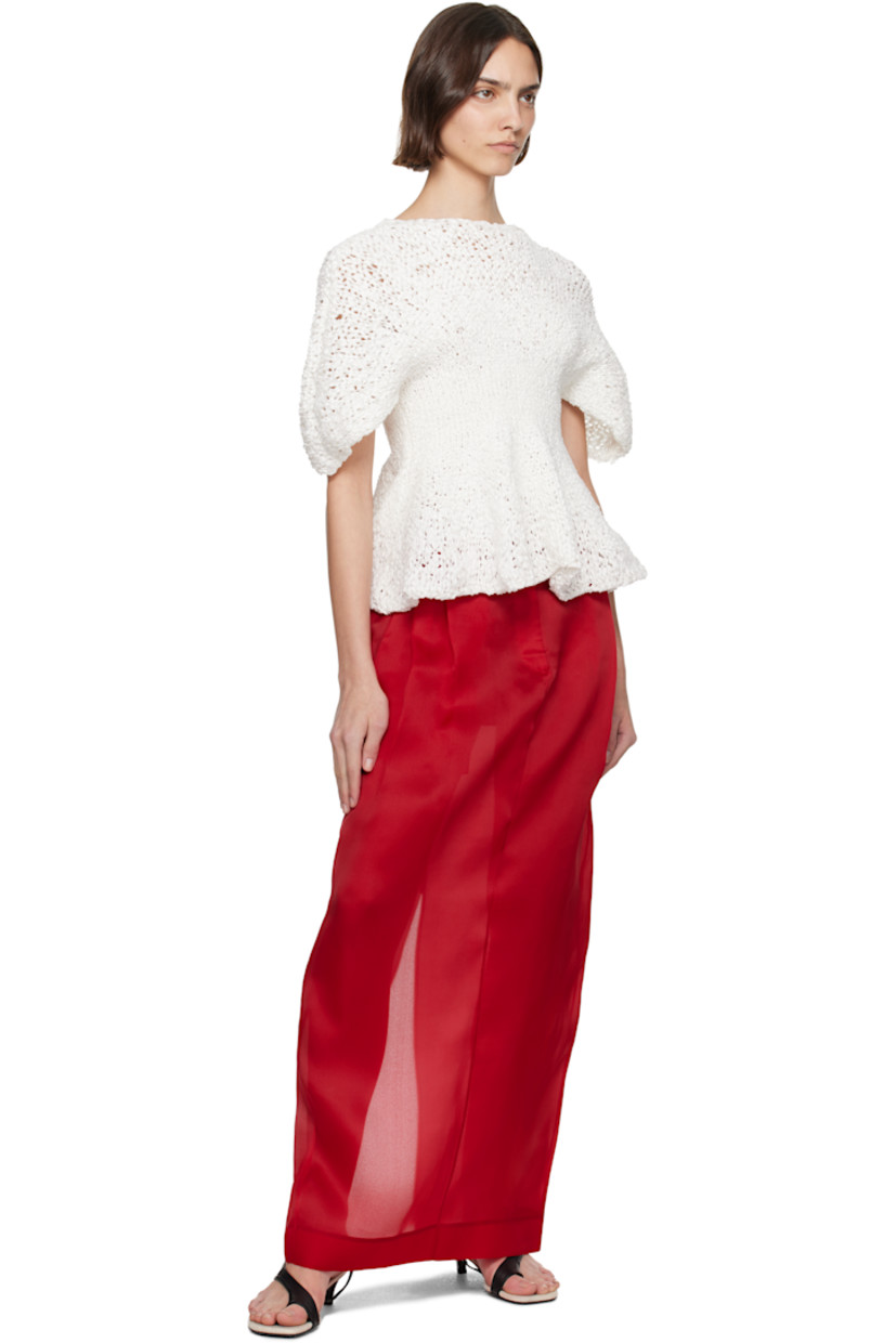 Semi-sheer hand-knit cotton-blend top. 

· Boatneck
· Peplum hem
· Yoke sleeves

Supplier color: Glaze