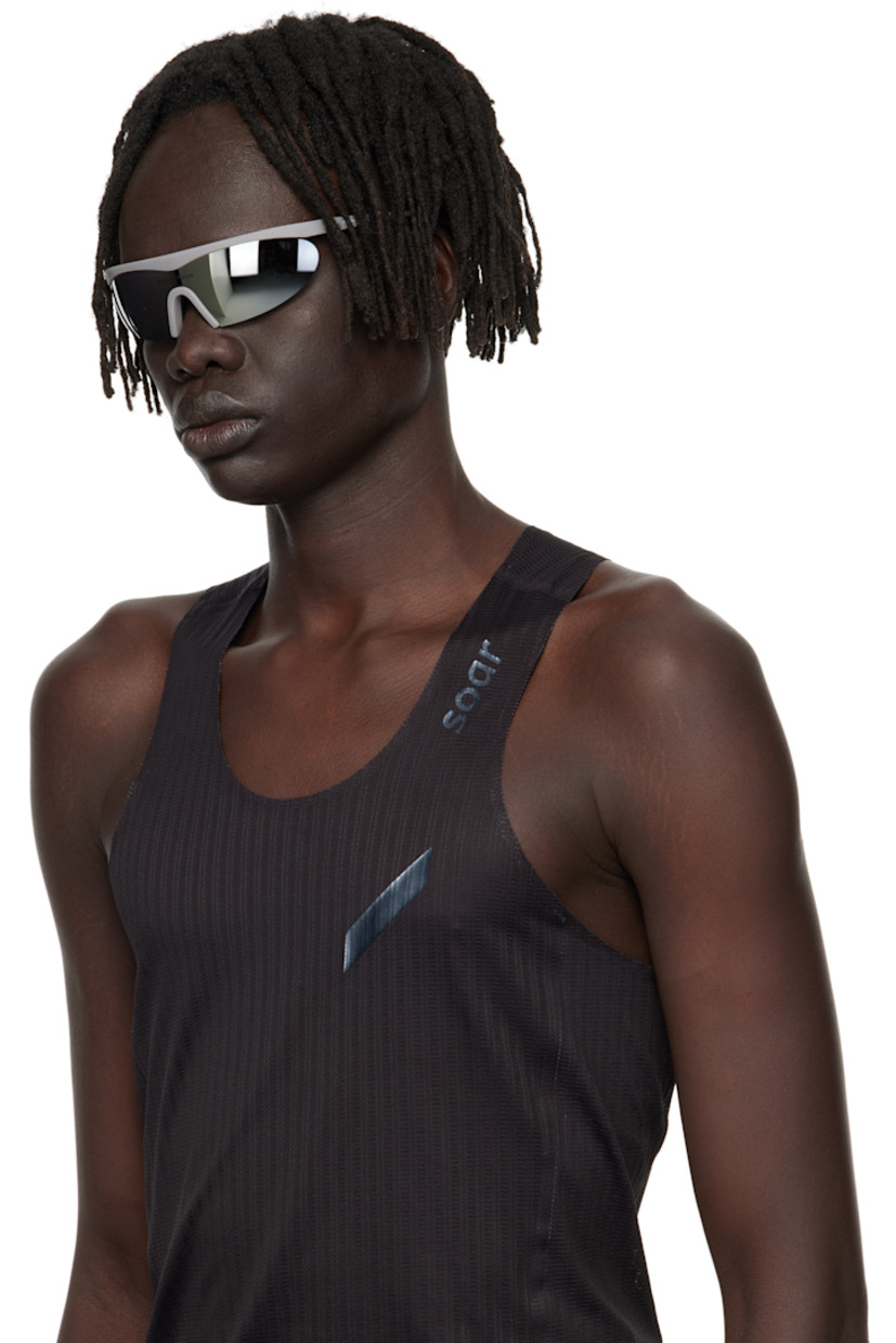 Shield-style semi-rimless acrylic-frame sunglasses.

· Mirrored silver tone lens with D+ lens technology
· 100% UVA/UVB protection
· Integrated rubber nose pads
· Logo printed at lens and temple
· Eyewear chain-compatible rubber temple tips
· Titanium hardware
· Includes microfiber pouch
· Size: 136 125

Supplier color: Flint/D+ G15  silver flash mirror