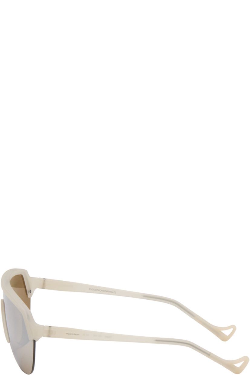 Shield-style semi-rimless semi-transparent acrylic-frame sunglasses.

· Mirrored copper tone lens with D+ lens technology
· 100% UVA/UVB protection
· Integrated rubber nose pads
· Logo printed at lens and temple
· Core wires
· Eyewear chain-compatible rubber temple tips
· Titanium hardware
· Includes microfiber pouch
· Size: 133 140

Supplier color: Morel/D+ copper mirror