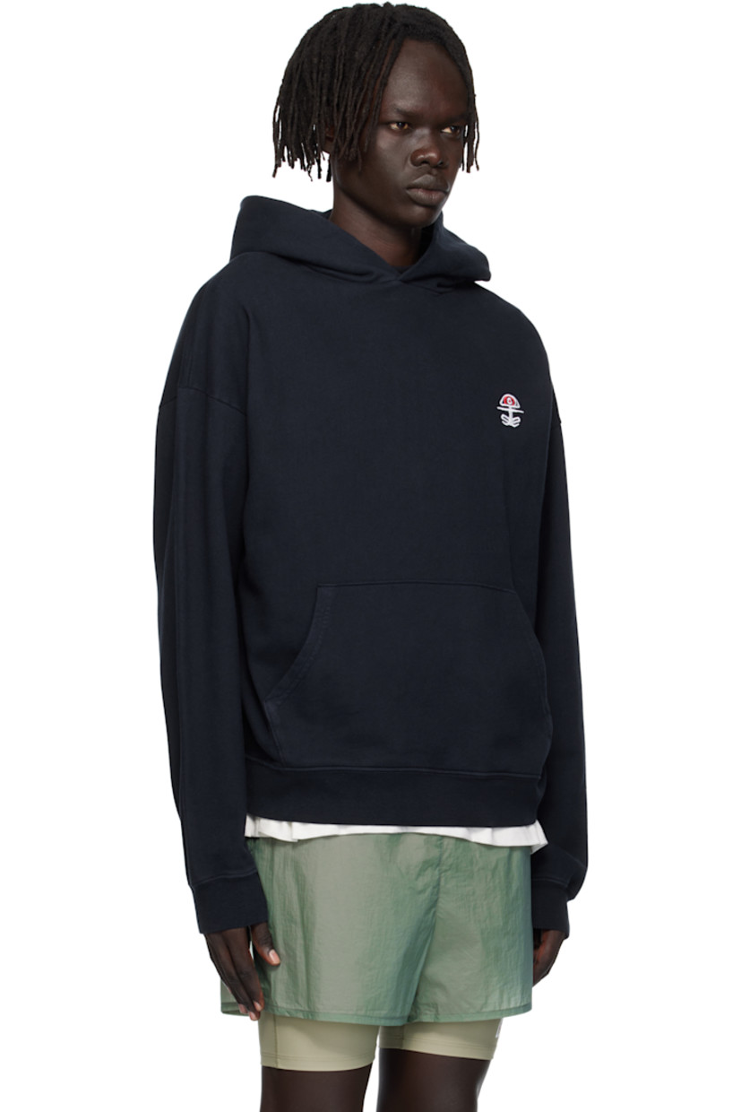 11.5 oz cotton fleece hoodie. 

· Pre-shrunk, pigment-dyed, and stonewashed
· Logo embroidered at chest
· Kangaroo pocket
· Rib-knit hem and cuffs
· Dropped shoulders

Supplier color: Chakra navy