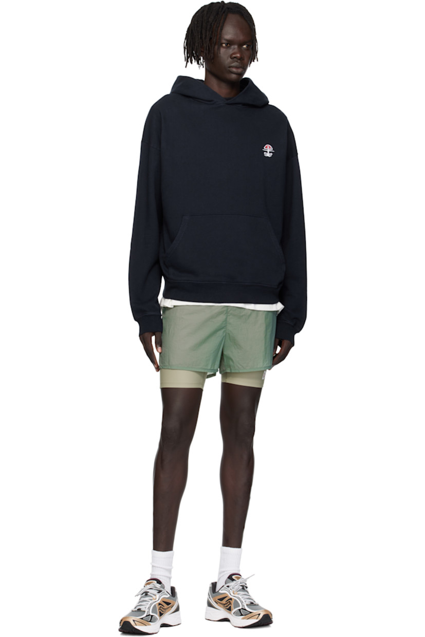 11.5 oz cotton fleece hoodie. 

· Pre-shrunk, pigment-dyed, and stonewashed
· Logo embroidered at chest
· Kangaroo pocket
· Rib-knit hem and cuffs
· Dropped shoulders

Supplier color: Chakra navy
