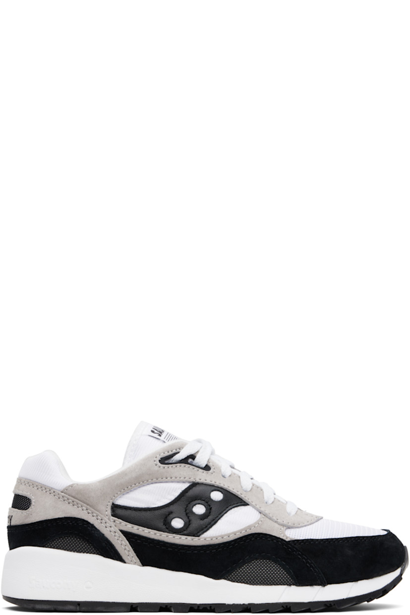 Low-top mesh and suede sneakers in white, black, and taupe.

· Lace-up closure
· Logo patch at padded tongue
· Padded collar
· Leather logo appliqué at sides
· Logo embroidered at heel counter
· Fleece lining
· Logo-embossed textured foam rubber midsole
· Treaded XT-600 rubber sole

Supplier color: White/Black