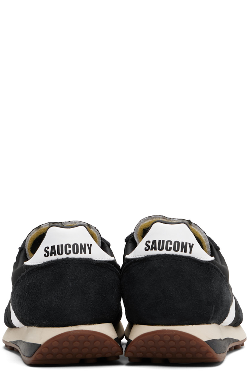 Low-top mesh and suede sneakers.

· Lace-up closure
· Logo patch at padded tongue
· Padded collar
· Buffed leather logo appliqué at sides
· Logo printed at heel tab
· Foam rubber midsole
· Treaded rubber sole

Supplier color: Black/White