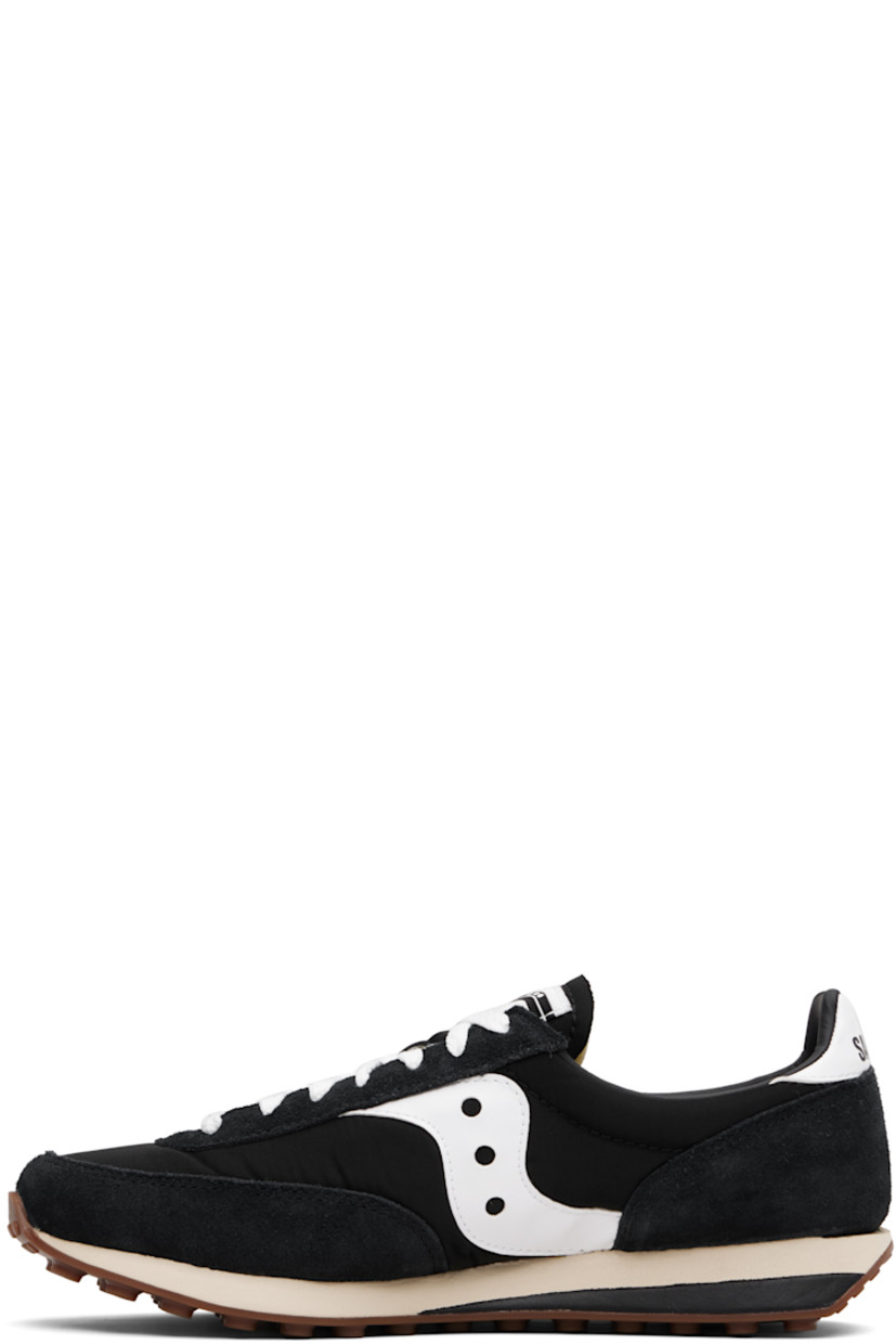 Low-top mesh and suede sneakers.

· Lace-up closure
· Logo patch at padded tongue
· Padded collar
· Buffed leather logo appliqué at sides
· Logo printed at heel tab
· Foam rubber midsole
· Treaded rubber sole

Supplier color: Black/White