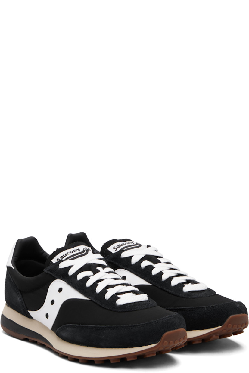 Low-top mesh and suede sneakers.

· Lace-up closure
· Logo patch at padded tongue
· Padded collar
· Buffed leather logo appliqué at sides
· Logo printed at heel tab
· Foam rubber midsole
· Treaded rubber sole

Supplier color: Black/White