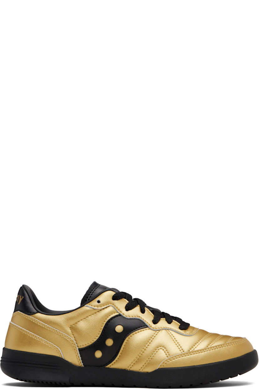 Low-top quilted grained leather sneakers.

· Lace-up closure
· Logo embossed at tongue
· Padded collar
· Logo appliqué at sides
· Logo embossed at heel tab
· Mesh lining
· Treaded rubber sole

Supplier color: Rich gold