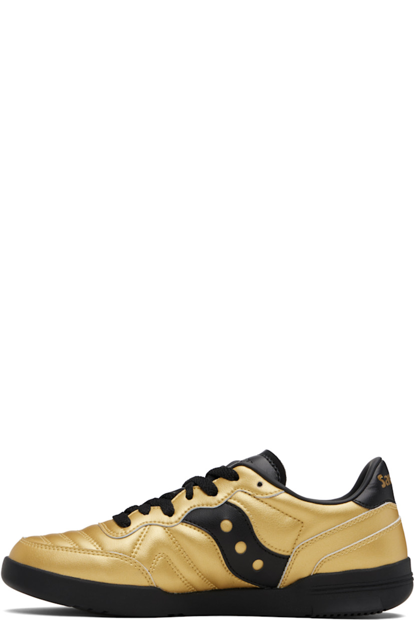 Low-top quilted grained leather sneakers.

· Lace-up closure
· Logo embossed at tongue
· Padded collar
· Logo appliqué at sides
· Logo embossed at heel tab
· Mesh lining
· Treaded rubber sole

Supplier color: Rich gold