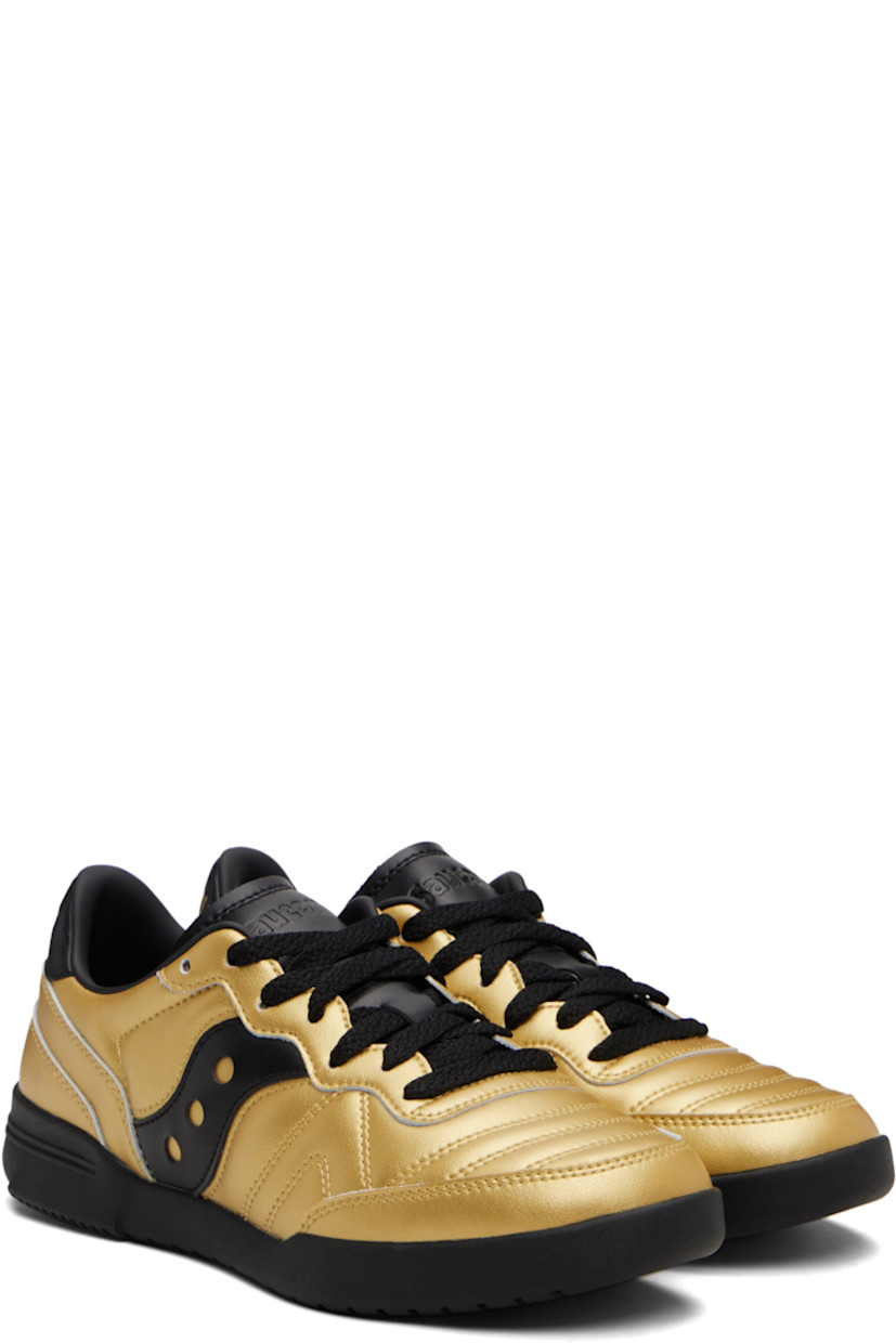 Low-top quilted grained leather sneakers.

· Lace-up closure
· Logo embossed at tongue
· Padded collar
· Logo appliqué at sides
· Logo embossed at heel tab
· Mesh lining
· Treaded rubber sole

Supplier color: Rich gold