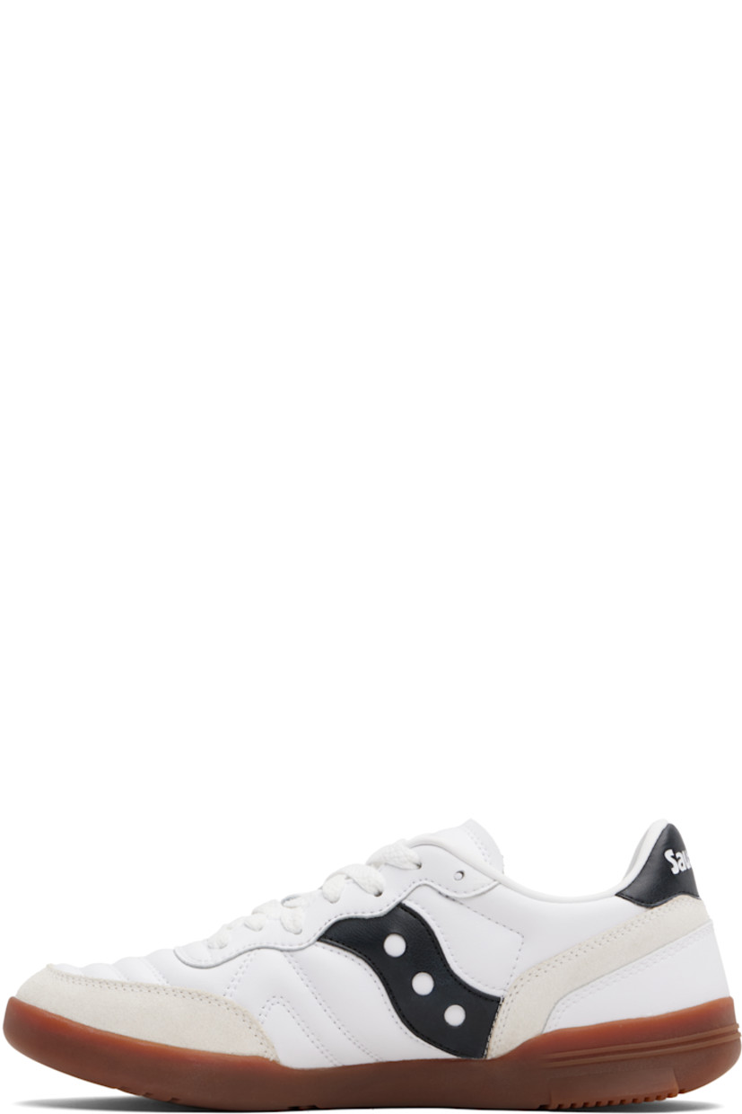 Low-top quilted leather and suede sneakers.

· Lace-up closure
· Logo embossed at tongue
· Padded collar
· Logo appliqué at sides
· Logo embossed at heel tab
· Mesh lining
· Treaded rubber sole

Supplier color: White/Black