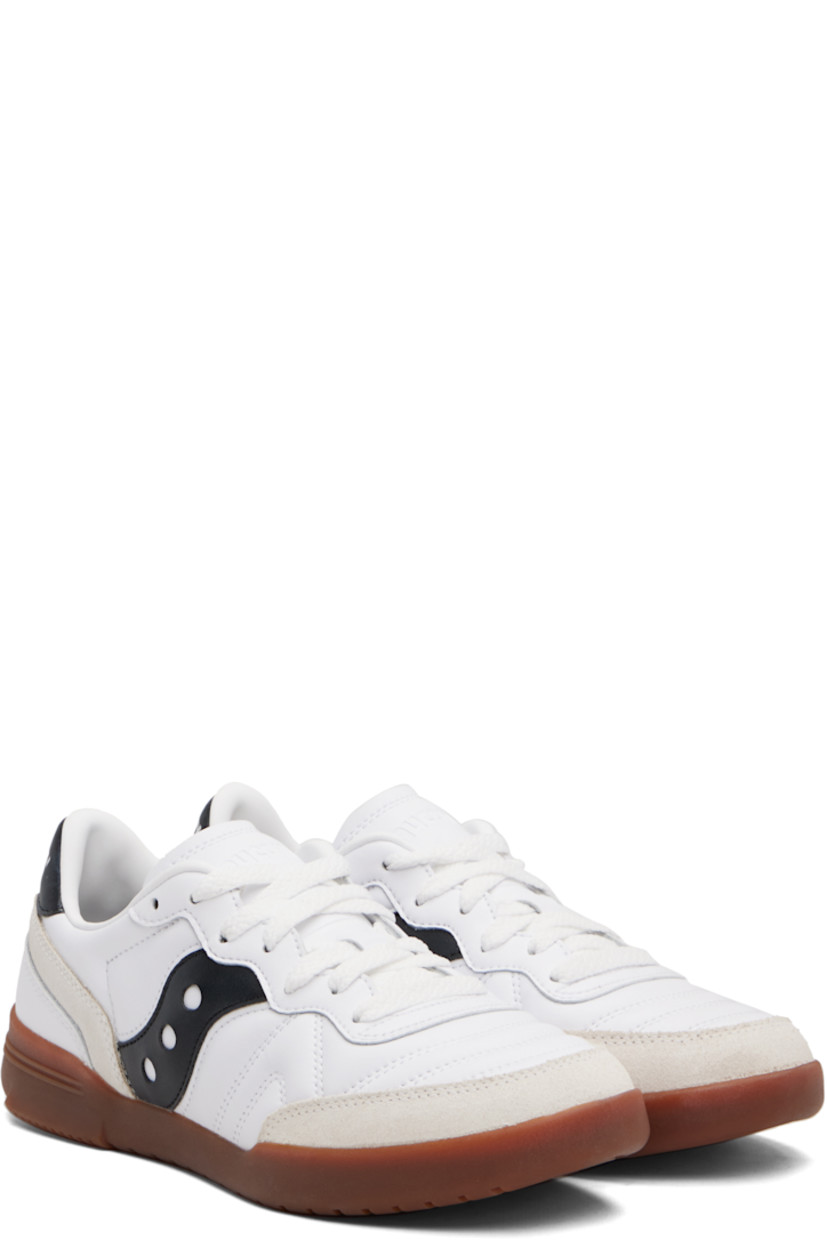 Low-top quilted leather and suede sneakers.

· Lace-up closure
· Logo embossed at tongue
· Padded collar
· Logo appliqué at sides
· Logo embossed at heel tab
· Mesh lining
· Treaded rubber sole

Supplier color: White/Black
