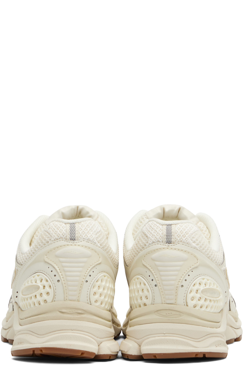Low-top mesh and grained faux-leather sneakers.

· Rubberized and bonded trim throughout
· Lace-up closure
· Logo patch at padded tongue
· Padded collar
· Logo appliqué at sides
· Arch-Lock technology at footbed
· Mesh lining
· ProGrid foam rubber midsole
· Treaded XT-900 rubber sole

Supplier color: Almond