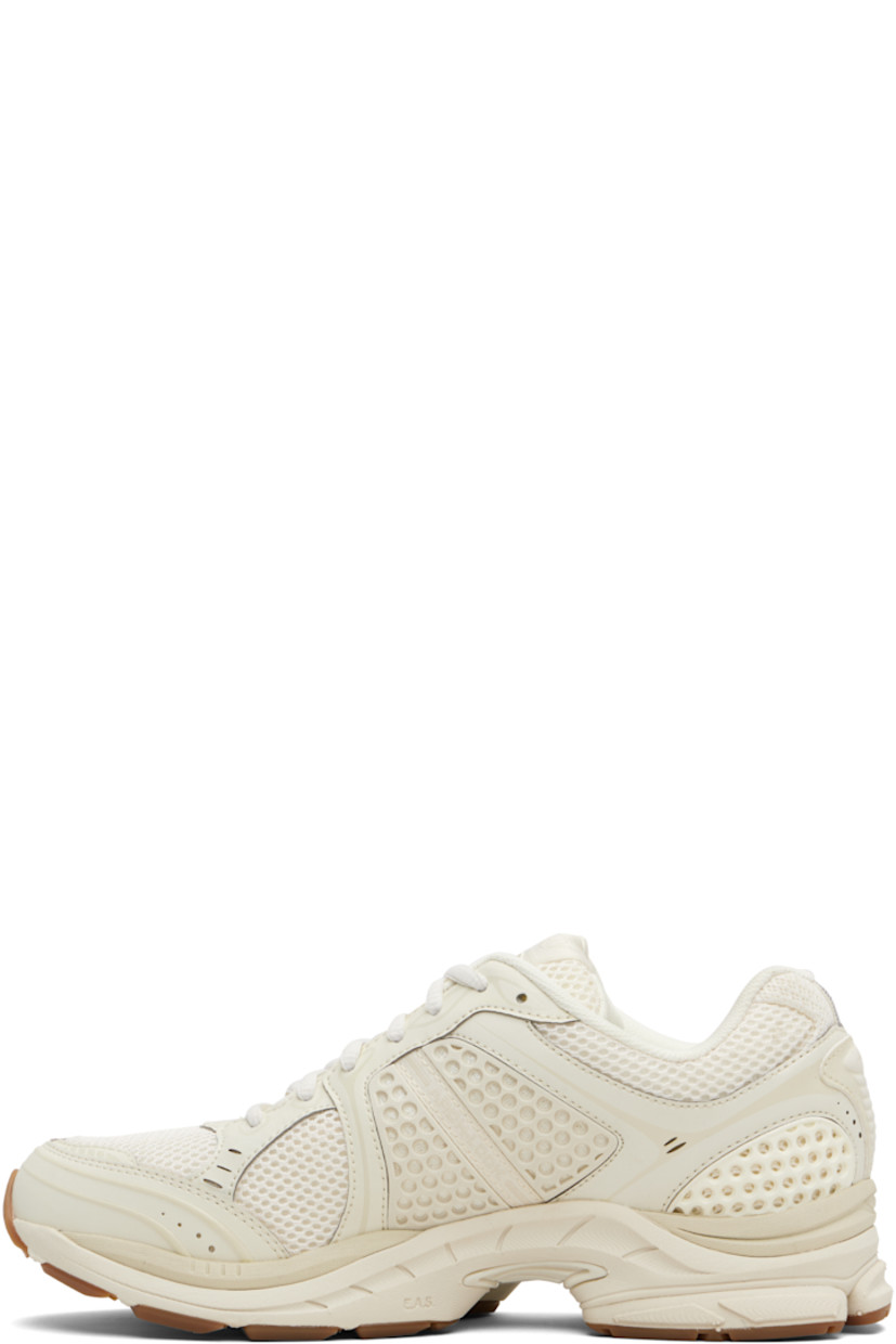 Low-top mesh and grained faux-leather sneakers.

· Rubberized and bonded trim throughout
· Lace-up closure
· Logo patch at padded tongue
· Padded collar
· Logo appliqué at sides
· Arch-Lock technology at footbed
· Mesh lining
· ProGrid foam rubber midsole
· Treaded XT-900 rubber sole

Supplier color: Almond