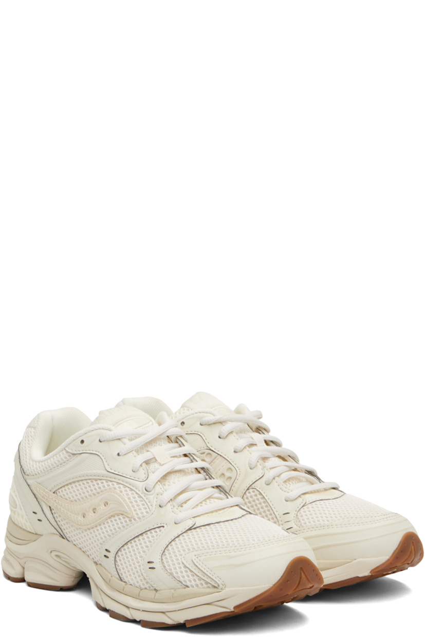 Low-top mesh and grained faux-leather sneakers.

· Rubberized and bonded trim throughout
· Lace-up closure
· Logo patch at padded tongue
· Padded collar
· Logo appliqué at sides
· Arch-Lock technology at footbed
· Mesh lining
· ProGrid foam rubber midsole
· Treaded XT-900 rubber sole

Supplier color: Almond