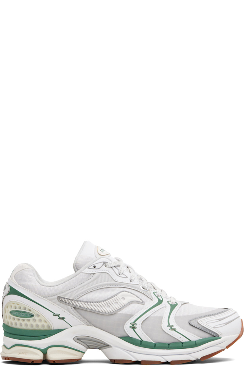 Low-top mesh and grained faux-leather sneakers.

· Rubberized and bonded trim throughout
· Lace-up closure
· Logo patch at padded tongue
· Padded collar
· Logo appliqué at sides
· Arch-Lock technology at footbed
· Mesh lining
· ProGrid foam rubber midsole
· Treaded XT-900 rubber sole

Supplier color: Light tan/Green