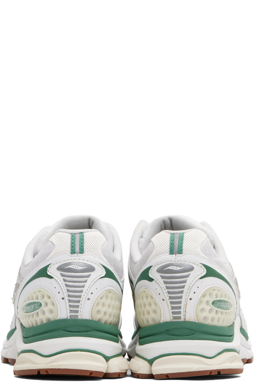 Low-top mesh and grained faux-leather sneakers.

· Rubberized and bonded trim throughout
· Lace-up closure
· Logo patch at padded tongue
· Padded collar
· Logo appliqué at sides
· Arch-Lock technology at footbed
· Mesh lining
· ProGrid foam rubber midsole
· Treaded XT-900 rubber sole

Supplier color: Light tan/Green