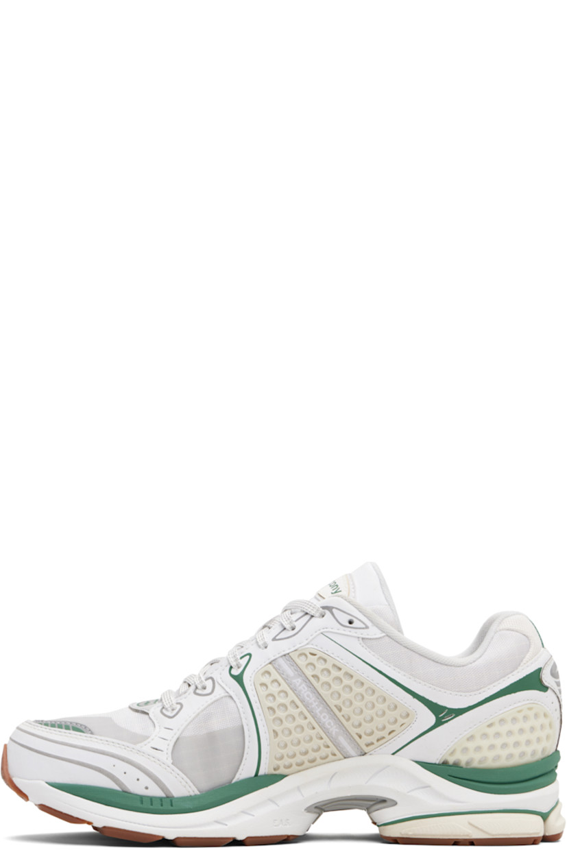 Low-top mesh and grained faux-leather sneakers.

· Rubberized and bonded trim throughout
· Lace-up closure
· Logo patch at padded tongue
· Padded collar
· Logo appliqué at sides
· Arch-Lock technology at footbed
· Mesh lining
· ProGrid foam rubber midsole
· Treaded XT-900 rubber sole

Supplier color: Light tan/Green