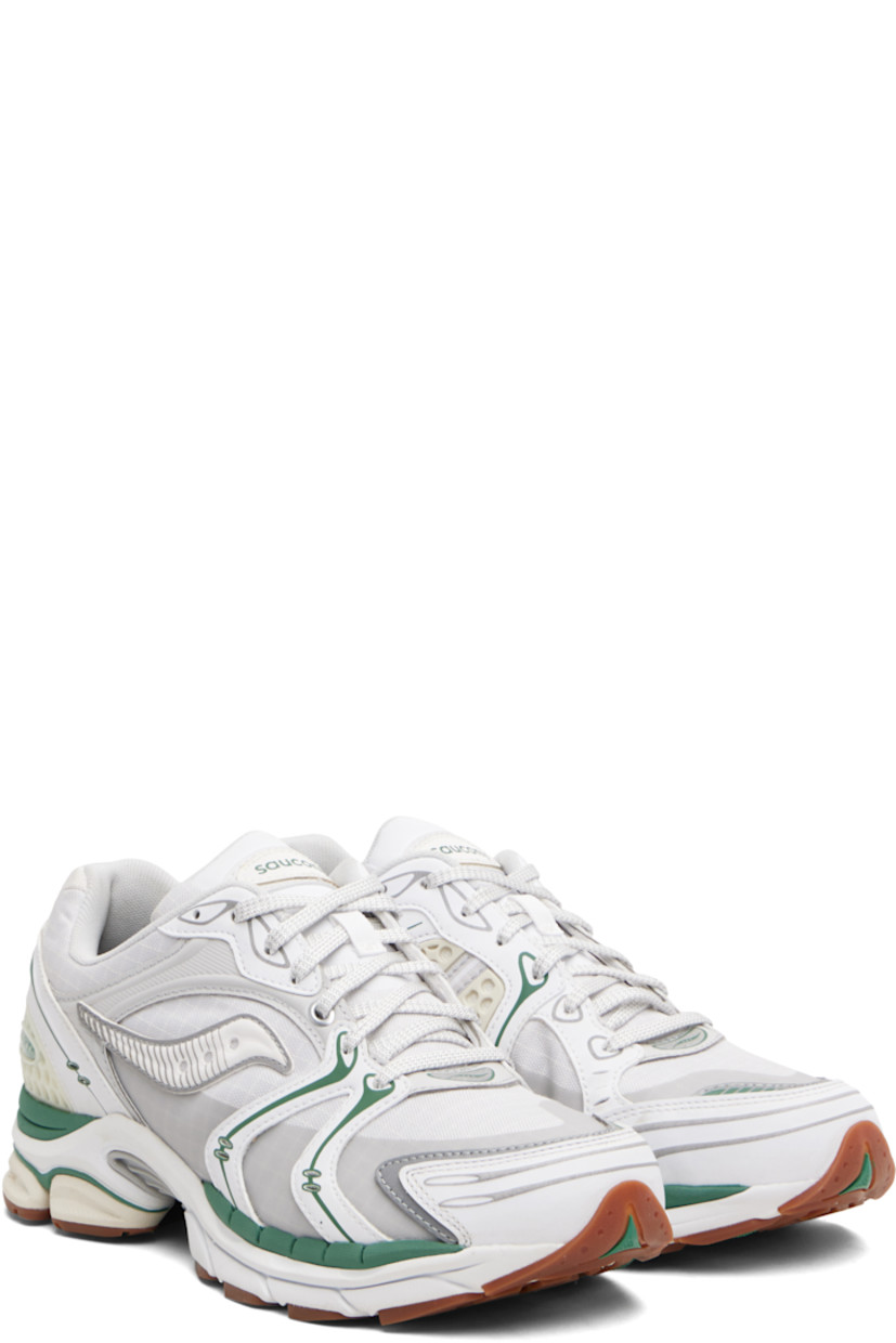 Low-top mesh and grained faux-leather sneakers.

· Rubberized and bonded trim throughout
· Lace-up closure
· Logo patch at padded tongue
· Padded collar
· Logo appliqué at sides
· Arch-Lock technology at footbed
· Mesh lining
· ProGrid foam rubber midsole
· Treaded XT-900 rubber sole

Supplier color: Light tan/Green