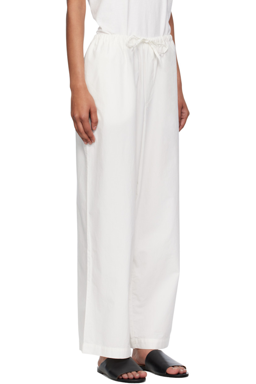 Peached organic cotton poplin lounge pants.

· Certified GOTS, OEKO-TEX®, and OCS 100
· Drawstring at elasticized waistband
· Two-pocket styling

Supplier color: Undyed