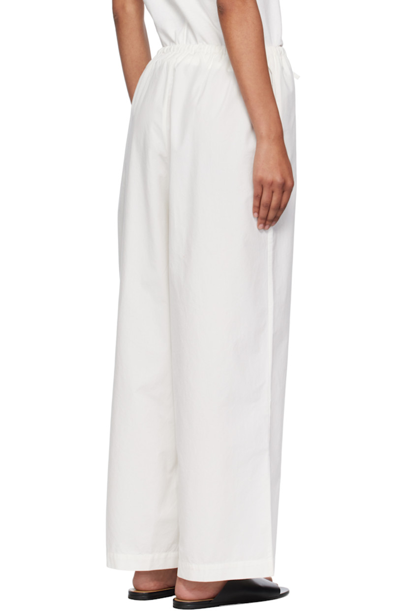 Peached organic cotton poplin lounge pants.

· Certified GOTS, OEKO-TEX®, and OCS 100
· Drawstring at elasticized waistband
· Two-pocket styling

Supplier color: Undyed